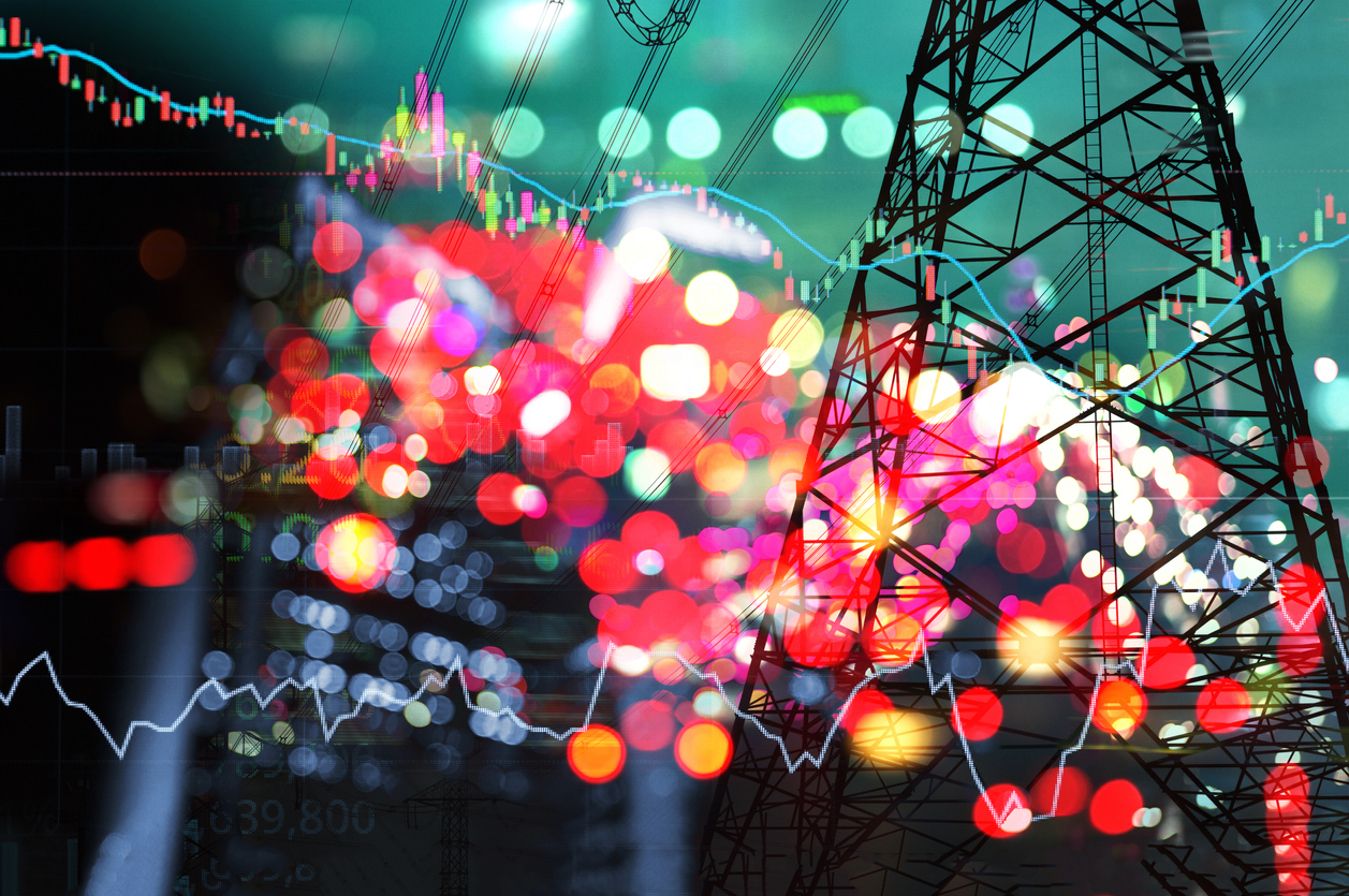 Abstract blended image of power transmission line with layered stock market lines and numbers.